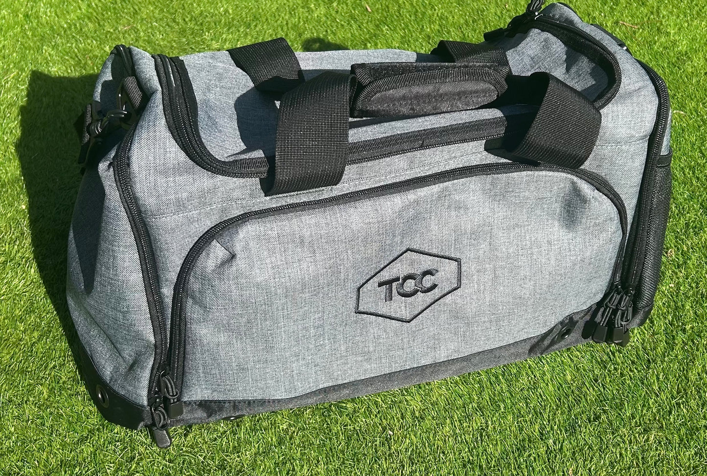 TCC Sports Holdall pictured on grass in Sunshine