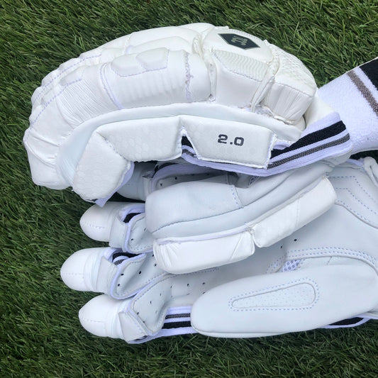 TCC 2.0 batting gloves showing the leather palm and the 3 side bar protection on the bottom hand