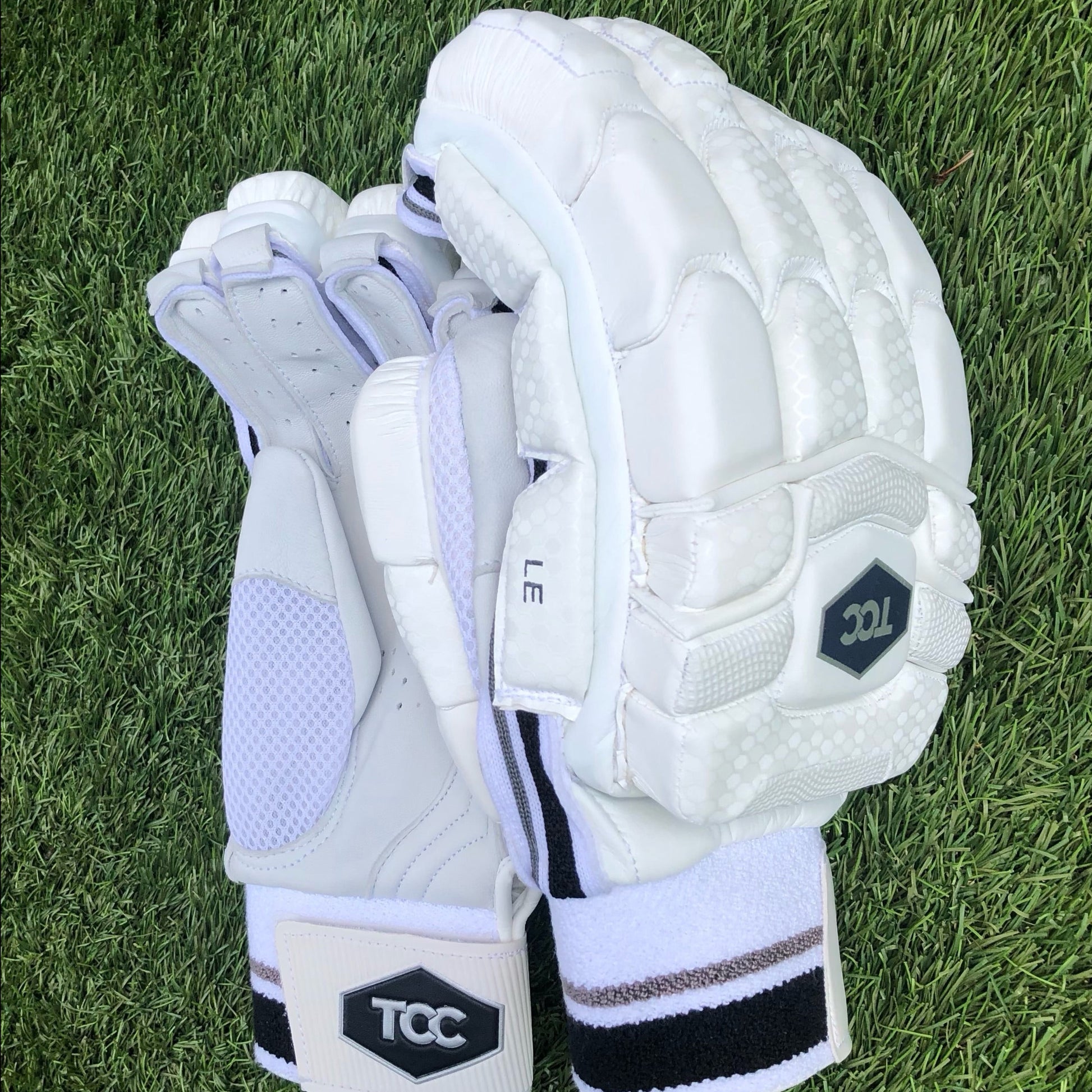 TCC premium batting gloves with TCC logo on wristband and back of the hand