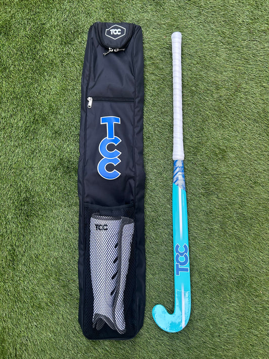 TCC Hockey Stick bag with TCC Pro Shin pads in the mesh pocket and teal and blue stick alongside the bag