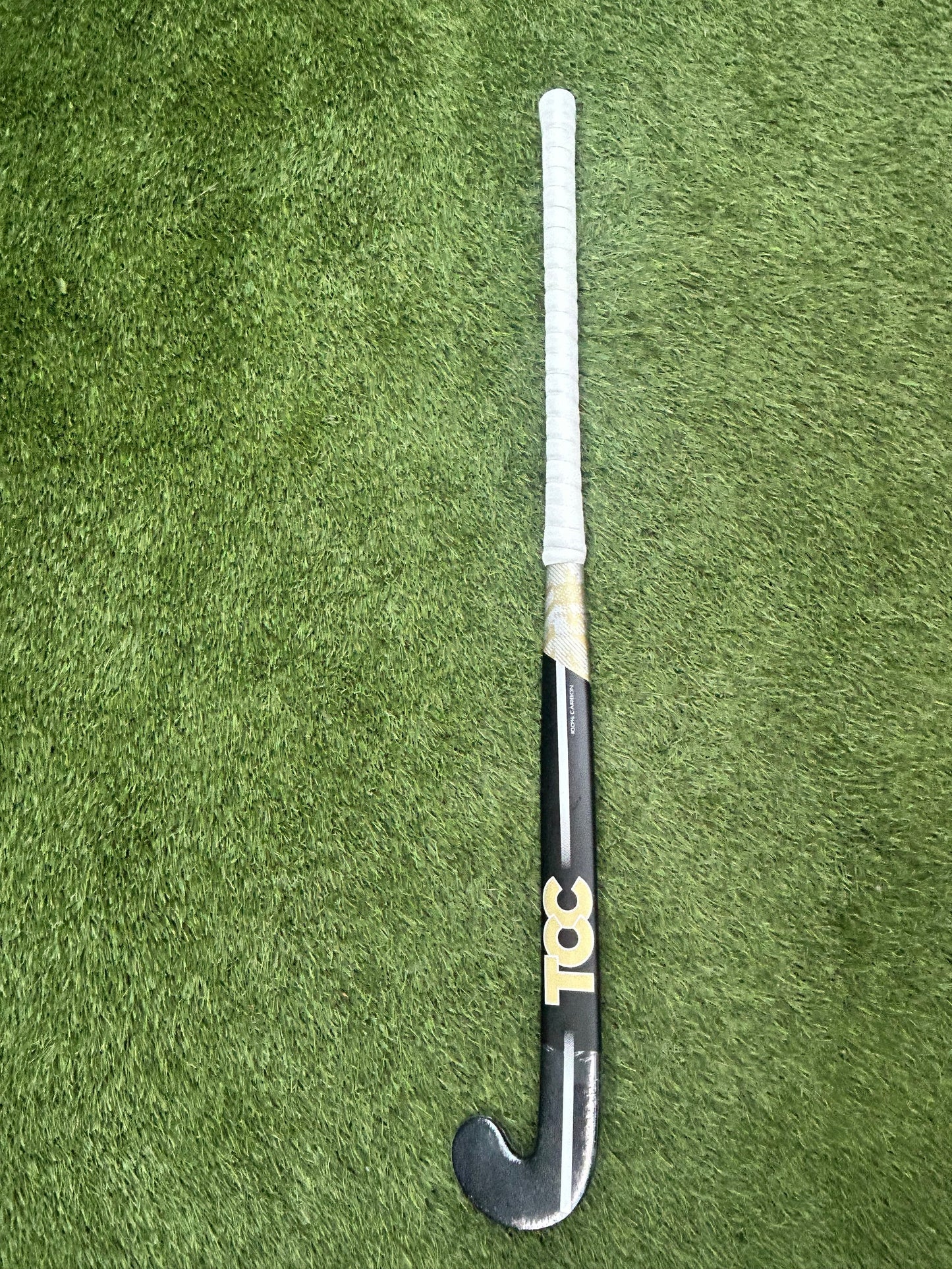 TCC T-99 Limited Edition Stick in Black and Gold on grass front view