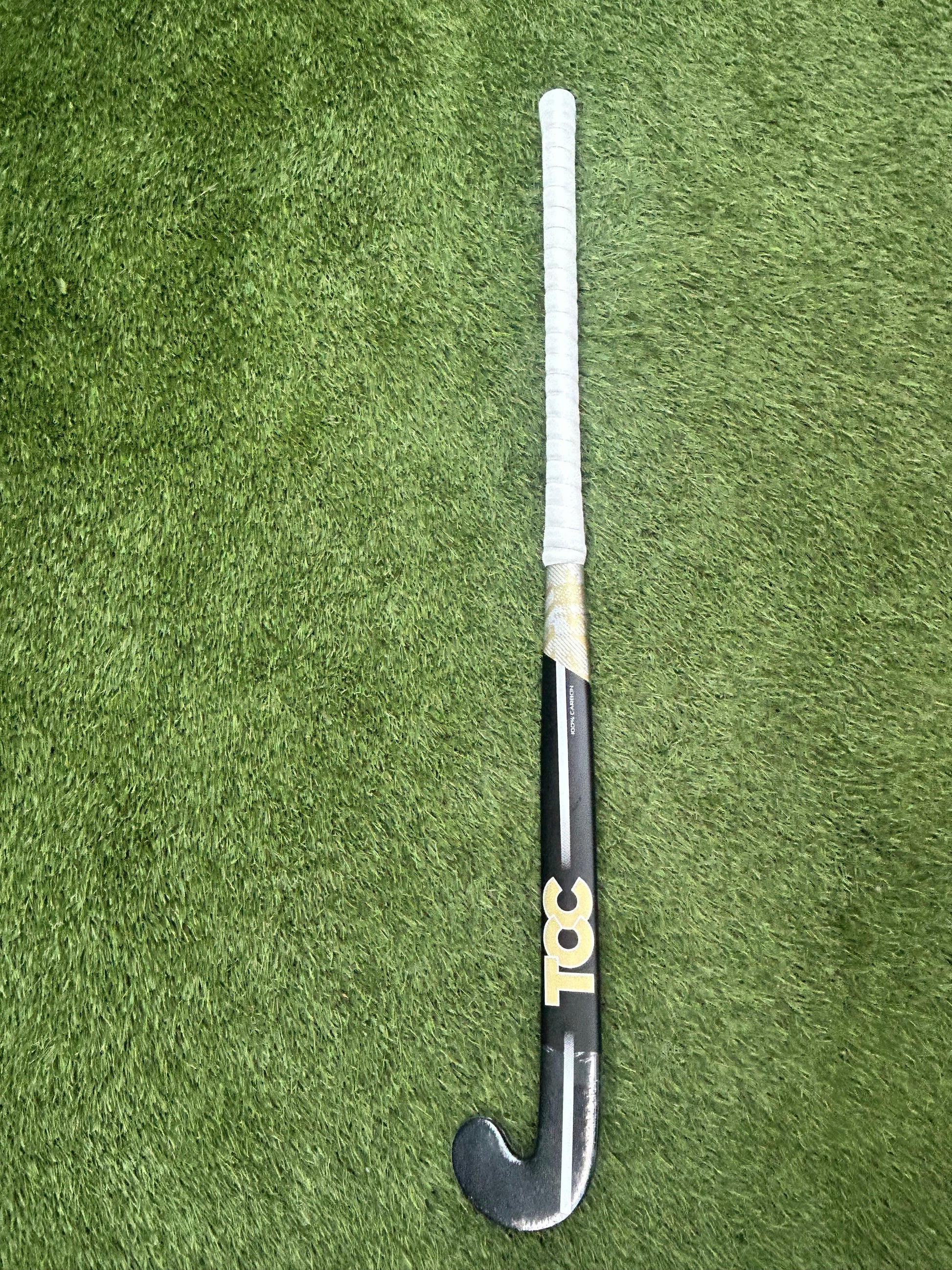 TCC T-99 Limited Edition Stick in Black and Gold on grass front view