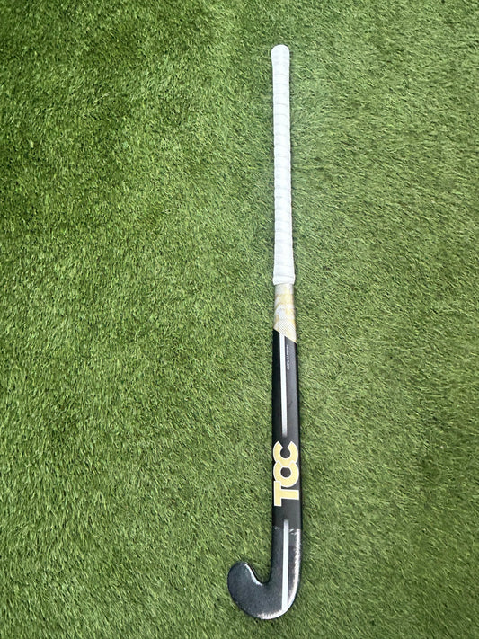 TCC T-99 Limited Edition Stick in Black and Gold on grass front view
